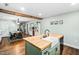 Open kitchen with butcher block island and view into dining area at 440 S Church St, Coats, NC 27521