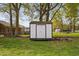 Small shed with double doors sitting on a grassy lawn at 440 S Church St, Coats, NC 27521