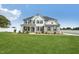 Charming two-story home with gray siding, black shutters, covered porch and a well manicured front lawn at 45 Pond Mountain Dr, Clayton, NC 27520