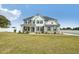 Charming two-story home with gray siding, a well-manicured lawn, and inviting curb appeal at 45 Pond Mountain Dr, Clayton, NC 27520