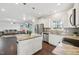 Open kitchen view with granite countertops, stainless steel appliances and connection to the living room at 45 Pond Mountain Dr, Clayton, NC 27520