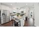 Modern kitchen featuring granite countertops, stainless steel appliances, and a convenient breakfast bar at 45 Pond Mountain Dr, Clayton, NC 27520