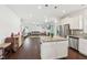 Open kitchen leading into the living room features granite countertops and stainless steel appliances at 45 Pond Mountain Dr, Clayton, NC 27520