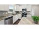 Contemporary kitchen featuring stainless steel appliances and granite countertops at 45 Pond Mountain Dr, Clayton, NC 27520