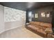 Finished media room featuring a projector screen, comfortable seating, and theater ambiance at 45 Pond Mountain Dr, Clayton, NC 27520