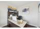 Office featuring dark wood floors, large desk, stylish decor, and built-in shelving at 45 Pond Mountain Dr, Clayton, NC 27520