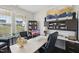 Bright office space with modern desk, built-in shelving, and large window at 45 Pond Mountain Dr, Clayton, NC 27520