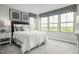 Serene bedroom with ample natural light, neutral color scheme, and comfortable furnishings, perfect for relaxation at 460 Grand Silo Rd, Garner, NC 27603