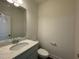 This powder room features a granite countertop and neutral wall paint at 480 Traditions Grande Blvd # 31, Wake Forest, NC 27587