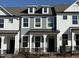 Charming two-story home with gray siding and a black iron fence at 480 Traditions Grande Blvd # 31, Wake Forest, NC 27587