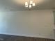Open-concept living room with modern lighting and spacious design at 480 Traditions Grande Blvd # 31, Wake Forest, NC 27587