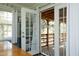 The back porch offers access through glass doors and features an outdoor living space at 5520 Mccormick Rd, Durham, NC 27713