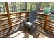 A comfortable chair on the back porch offers a relaxing outdoor retreat at 5520 Mccormick Rd, Durham, NC 27713