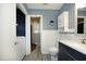 Bathroom featuring toilet, sink vanity, tub, and washer/dryer at 5520 Mccormick Rd, Durham, NC 27713