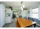 Dining room with a wooden table and chairs with a view to the kitchen at 5520 Mccormick Rd, Durham, NC 27713