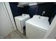 Laundry room with white washer and dryer machines at 5520 Mccormick Rd, Durham, NC 27713