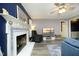 Inviting living room with brick fireplace, comfortable seating, and ceiling fan at 5520 Mccormick Rd, Durham, NC 27713