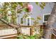 Backyard featuring a spacious wood deck, beautiful backyard views, and a charming home exterior at 5608 Ventura Dr, Durham, NC 27712