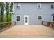 A wood deck complements the home's exterior, set against the backdrop of lush trees and landscaping at 5608 Ventura Dr, Durham, NC 27712
