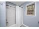 Bright bathroom featuring a tub with a shower behind a curtain and a window for natural light at 5608 Ventura Dr, Durham, NC 27712