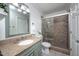 Inviting bathroom featuring granite countertop, framed glass shower, and tile flooring at 5608 Ventura Dr, Durham, NC 27712