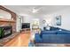Bright living room with hardwood floors, fireplace, and open access to the dining area creating a cohesive space at 5608 Ventura Dr, Durham, NC 27712