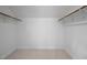 Walk-in closet providing substantial storage space with ample shelving and carpeted flooring at 5608 Ventura Dr, Durham, NC 27712