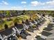 Aerial view of townhomes, showcasing a well-planned community near a golf course at 5980 Osprey Cove Dr, Raleigh, NC 27604