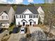 Aerial view of charming townhouses with a well-manicured lawns at 5980 Osprey Cove Dr, Raleigh, NC 27604