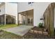 Back exterior of home featuring a screened porch and landscaped yard at 5980 Osprey Cove Dr, Raleigh, NC 27604