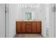 Bright bathroom featuring double sinks, a large mirror, and a separate toilet and shower area at 5980 Osprey Cove Dr, Raleigh, NC 27604