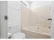Bathroom featuring white walls, an oval tub and toilet at 5980 Osprey Cove Dr, Raleigh, NC 27604