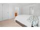 Spacious bedroom with white walls, soft carpet, and multiple doorways at 5980 Osprey Cove Dr, Raleigh, NC 27604