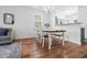 Bright dining room with modern table and wood floors at 5980 Osprey Cove Dr, Raleigh, NC 27604