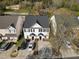 View of a charming two-story townhouse with a well-manicured front lawn at 5980 Osprey Cove Dr, Raleigh, NC 27604
