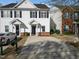 Charming two-story townhouse with a well-manicured front lawn at 5980 Osprey Cove Dr, Raleigh, NC 27604
