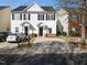 Charming two-story townhouse with a well-manicured front lawn at 5980 Osprey Cove Dr, Raleigh, NC 27604