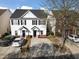 Charming townhome with white siding, black shutters, and well-maintained landscaping at 5980 Osprey Cove Dr, Raleigh, NC 27604