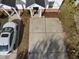 Aerial view of townhouse showing driveway and manicured landscaping at 5980 Osprey Cove Dr, Raleigh, NC 27604