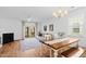 Cozy living space featuring a fireplace, dining table, and sliding glass doors to patio at 5980 Osprey Cove Dr, Raleigh, NC 27604