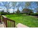 A spacious backyard is complemented by lush green grass and mature trees at 6 Preakness Dr, Durham, NC 27713