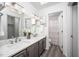 Bathroom features dual sinks, modern fixtures, and a skylight for natural light at 6 Preakness Dr, Durham, NC 27713