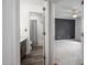 Bathroom with wood floors, granite countertop, shower, and view to the main bedroom at 6 Preakness Dr, Durham, NC 27713