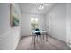 Bright bedroom with a desk, chair and an artistic painting on the wall at 6 Preakness Dr, Durham, NC 27713