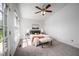 Carpeted bedroom featuring natural light, ceiling fan and modern decor at 6 Preakness Dr, Durham, NC 27713
