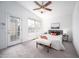 Bedroom showing natural light, ceiling fan, and access to outdoor deck at 6 Preakness Dr, Durham, NC 27713