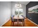 Well-lit dining room featuring hardwood floors, and a stylish light fixture at 6 Preakness Dr, Durham, NC 27713
