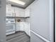 Bright kitchen with white cabinets, granite countertops, and stainless steel appliances at 6 Preakness Dr, Durham, NC 27713