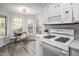 Well-lit kitchen with stainless steel appliances and an adjacent breakfast nook at 6 Preakness Dr, Durham, NC 27713