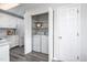 Kitchen featuring a laundry room with white washer and dryer behind the cabinet at 6 Preakness Dr, Durham, NC 27713